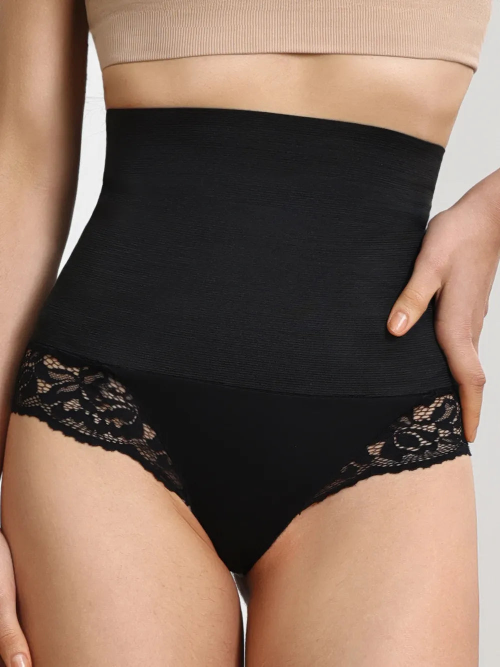 High-waisted black lace shapewear panties for women, lingerie style, closeup view